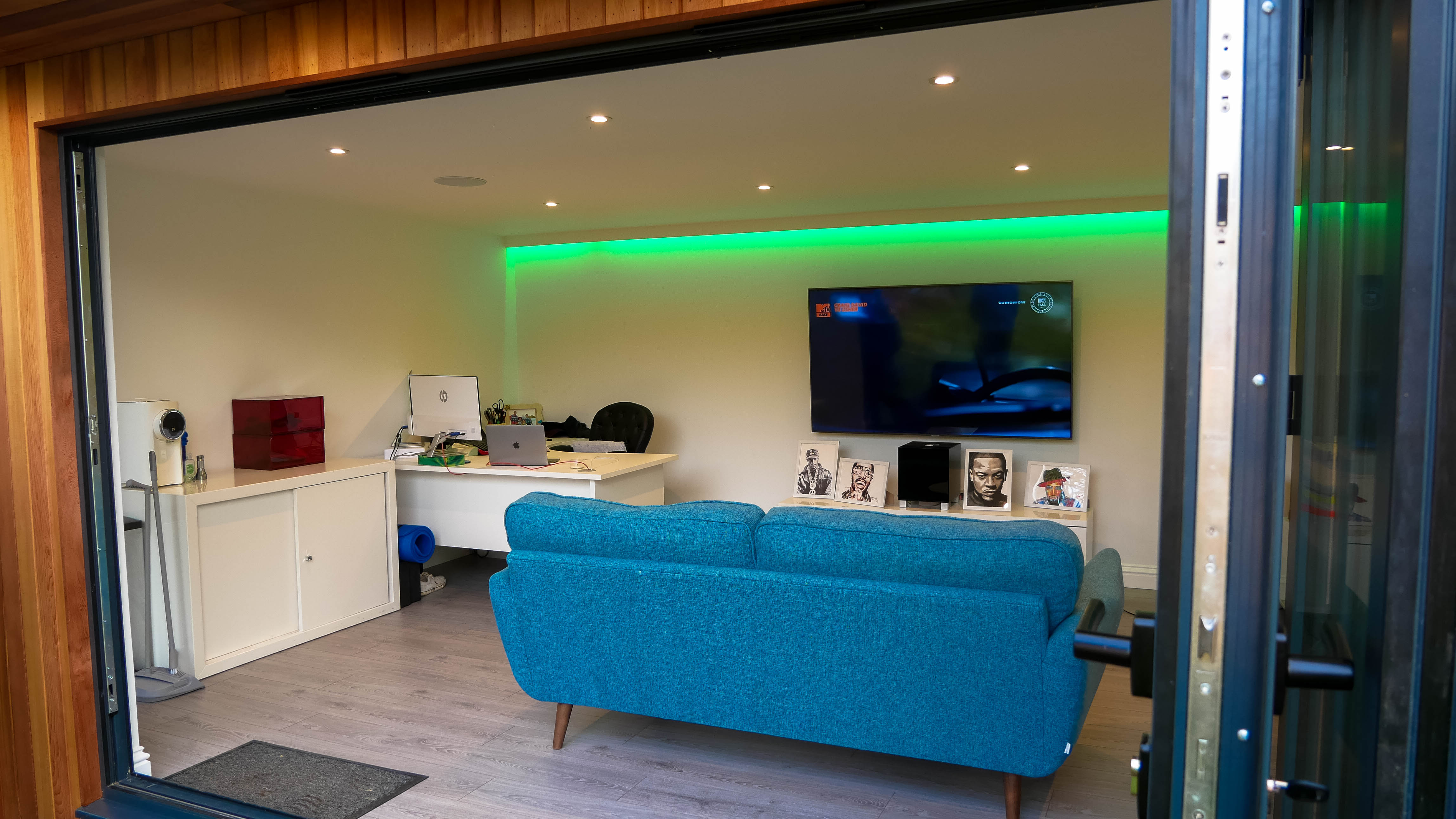 man cave garden studio with speakers in ceiling and LED strip downlighter in crawley sussex